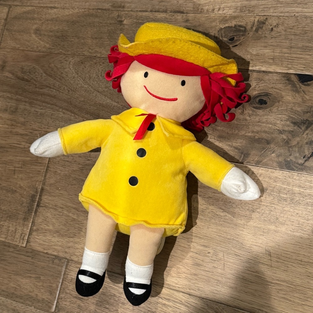 Madeline Kohls Cares doll with yellow rain coat and hat